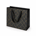Sac cadeau 30 x 12 x 25 cm en papier noir doré à anses textiles motif géométrique